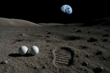 Golf balls on the moon surface from Apollo 14 mission showing lunar terrain and Earth in background